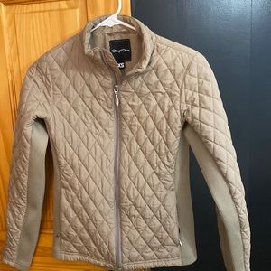 Taupe Straight Down quilted jacket. Ribbed stretch on sides with zippered cuffs